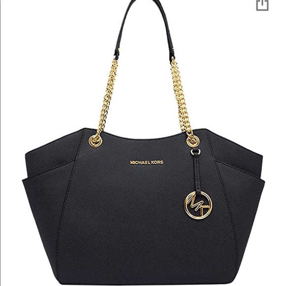 Gold Michael Kors lettering and leather exterior. - Picture 1 of 1